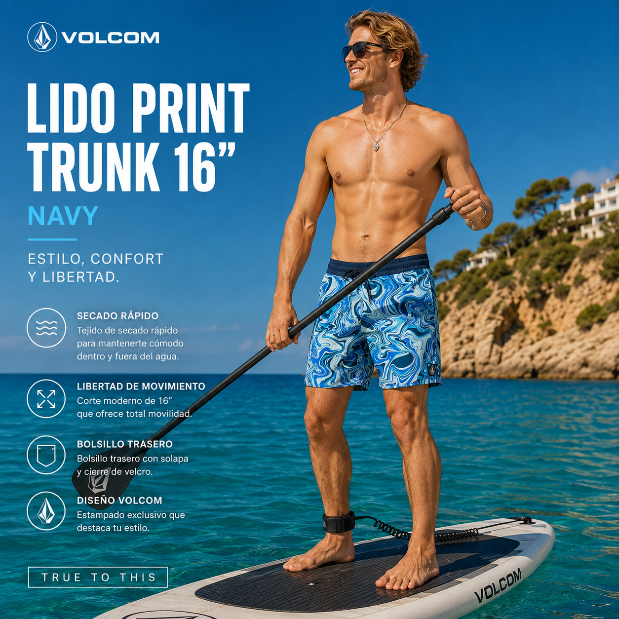 Bañador Volcom Lido Print Trunk 16 Navy practicando paddle surf en aguas cristalinas con estilo surf premium