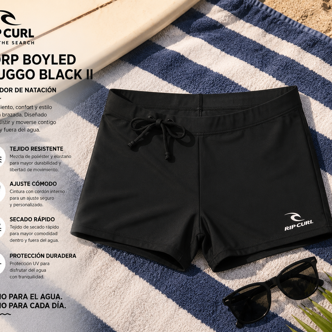 Bañador de natación Rip Curl Corp Boyleg Sluggo Black II sobre toalla de playa en escena surf lifestyle premium