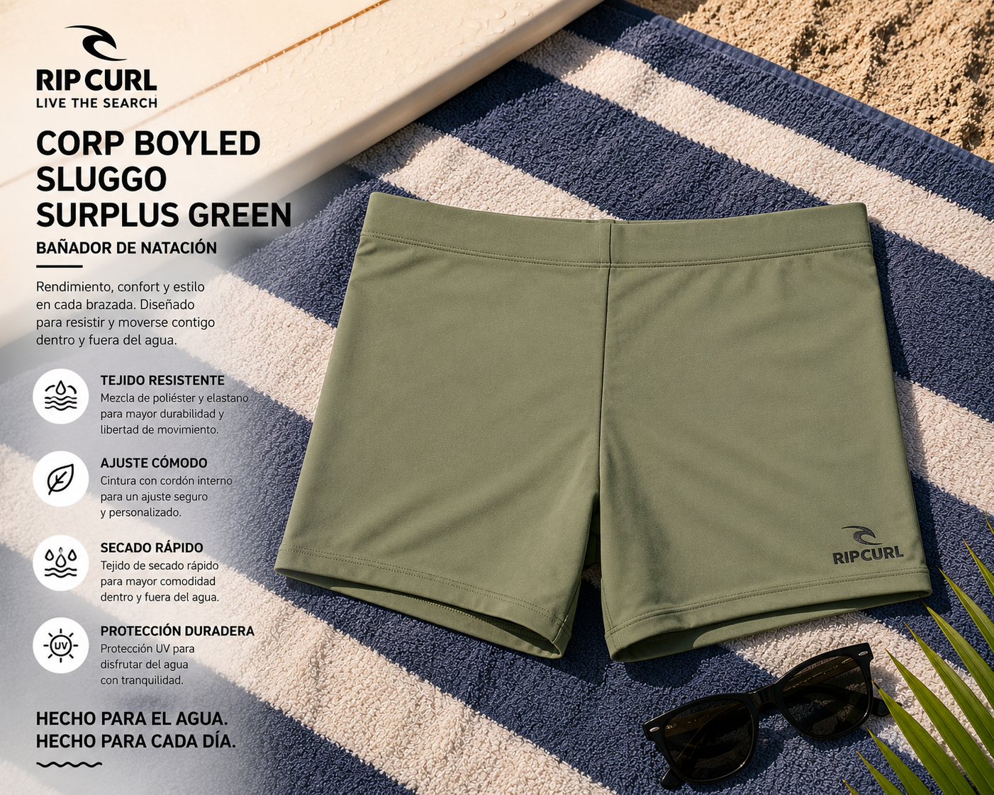 Bañador de natación Rip Curl Corp Boyleg Sluggo Surplus Green sobre toalla de playa en escena surf lifestyle premium