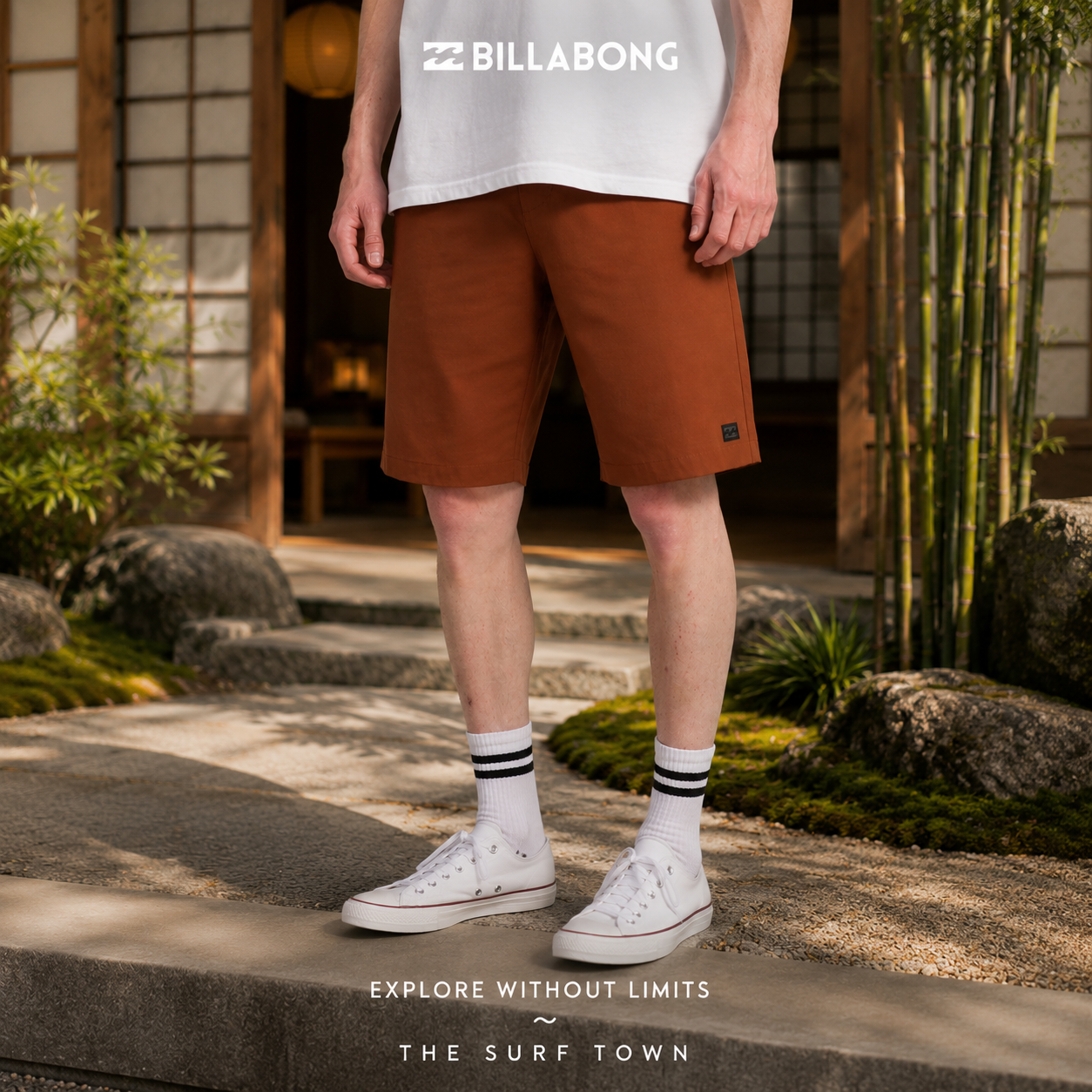 Bermudas Billabong Hibrido Crossfire Solid 20 Rustic Brown para hombre en jardín japonés minimalista con fotografía editorial propia de THE SURF TOWN, estilo surf lifestyle premium y ambiente relajado de viaje