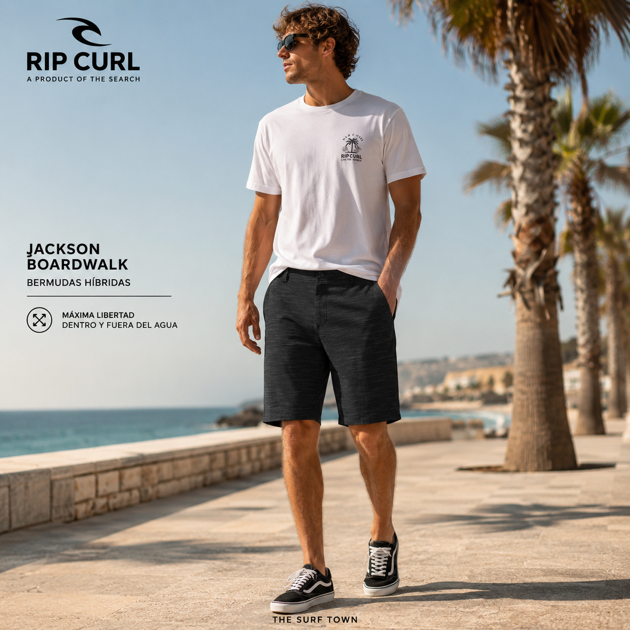 Bermudas híbridas Rip Curl Jackson Boardwalk Black para hombre en paseo marítimo junto al mar, fotografía editorial propia de THE SURF TOWN con estilo surf lifestyle premium