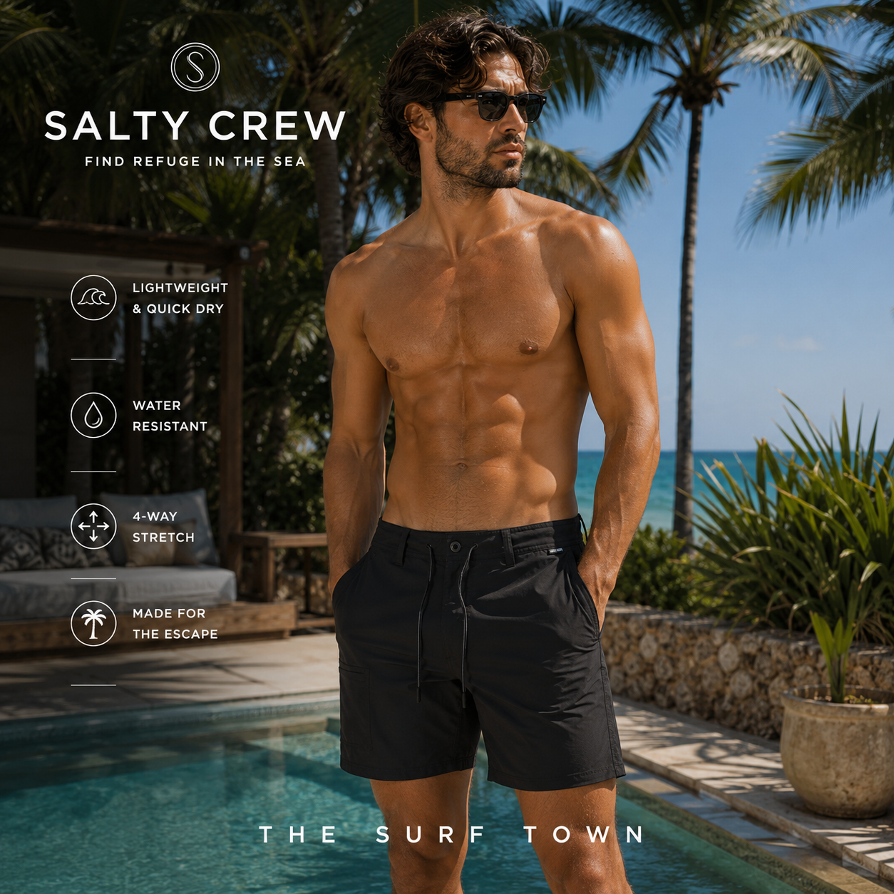 Bermudas Salty Crew Transom Tech Short Phantom en zona chill-out junto a piscina, fotografía editorial propia de THE SURF TOWN con modelo masculino surf lifestyle, bermuda técnica negra de secado rápido y estilo premium para verano