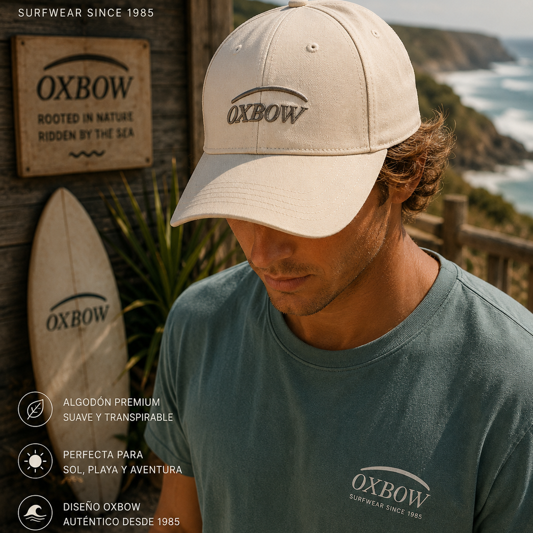 Gorra Oxbow Elini Rock beige con logo frontal en escenario coastal premium y estética editorial surf cinematográfica