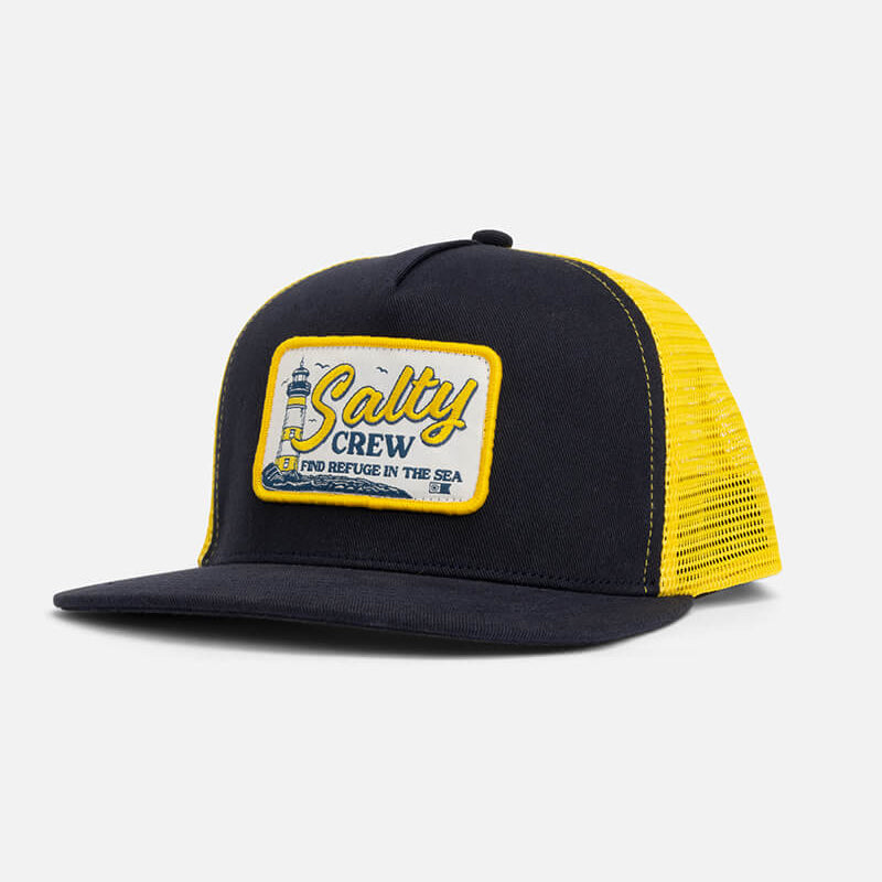 Gorra Salty Crew Ashore Trucker Navy Gold estilo trucker con rejilla y parche frontal