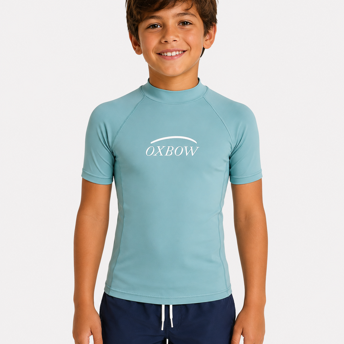Licra Oxbow verde agua de niño para surf y playa con protección solar UV y estilo surfwear infantil verano 2026
