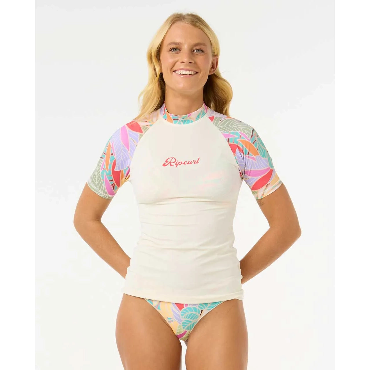 Licra RIP CURL Cala Vadella mujer con protección solar UPF 50 diseño surf manga corta estampada