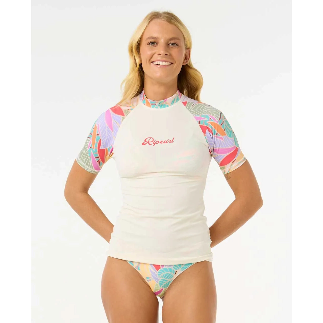 Licra RIP CURL Cala Vadella mujer con protección solar UPF 50 diseño surf manga corta estampada