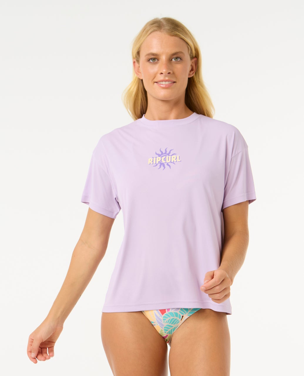 Licra RIP CURL Cala Vadella Surflite mujer color lila protección UV50 surf manga corta