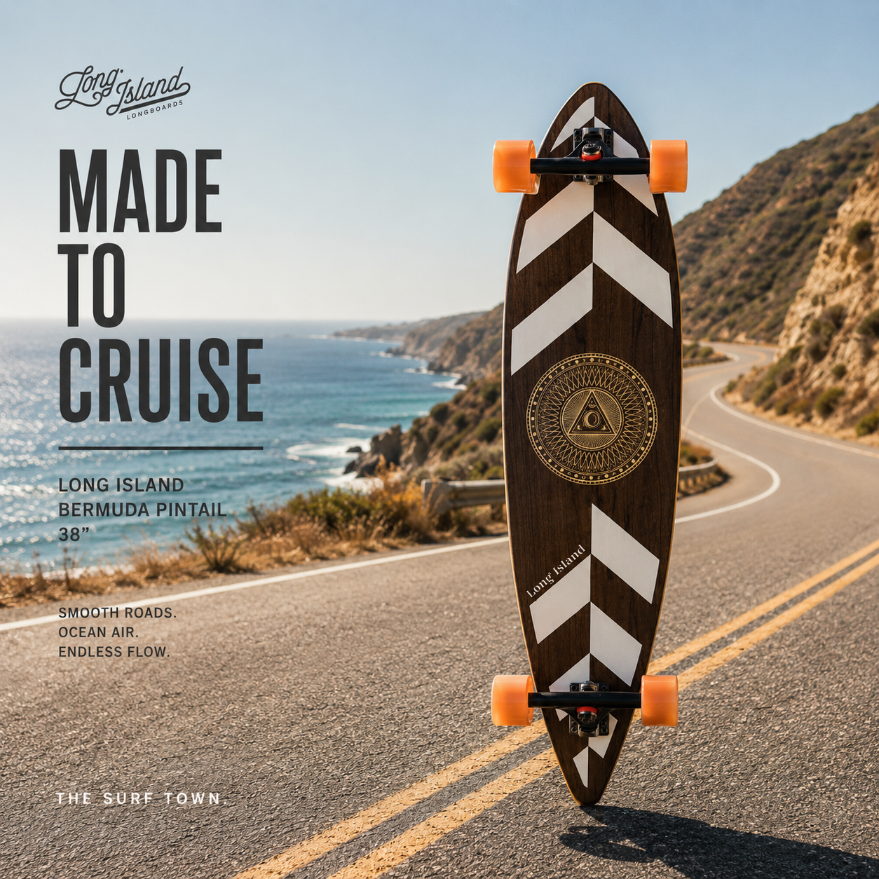 LongSkate Long Island Bermuda Pintail 38 en imagen exclusiva creada por THE SURF TOWN sobre carretera costera premium con fotografía original surf skate lifestyle y vistas al océano