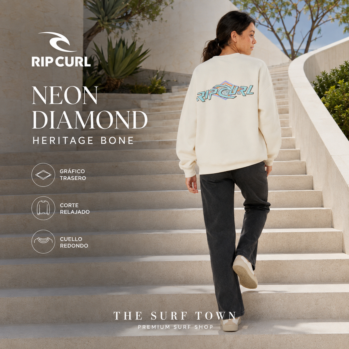 Mujer con sudadera Rip Curl Neon Diamond Heritage Bone mostrando el gráfico trasero, imagen editorial propia de THE SURF TOWN