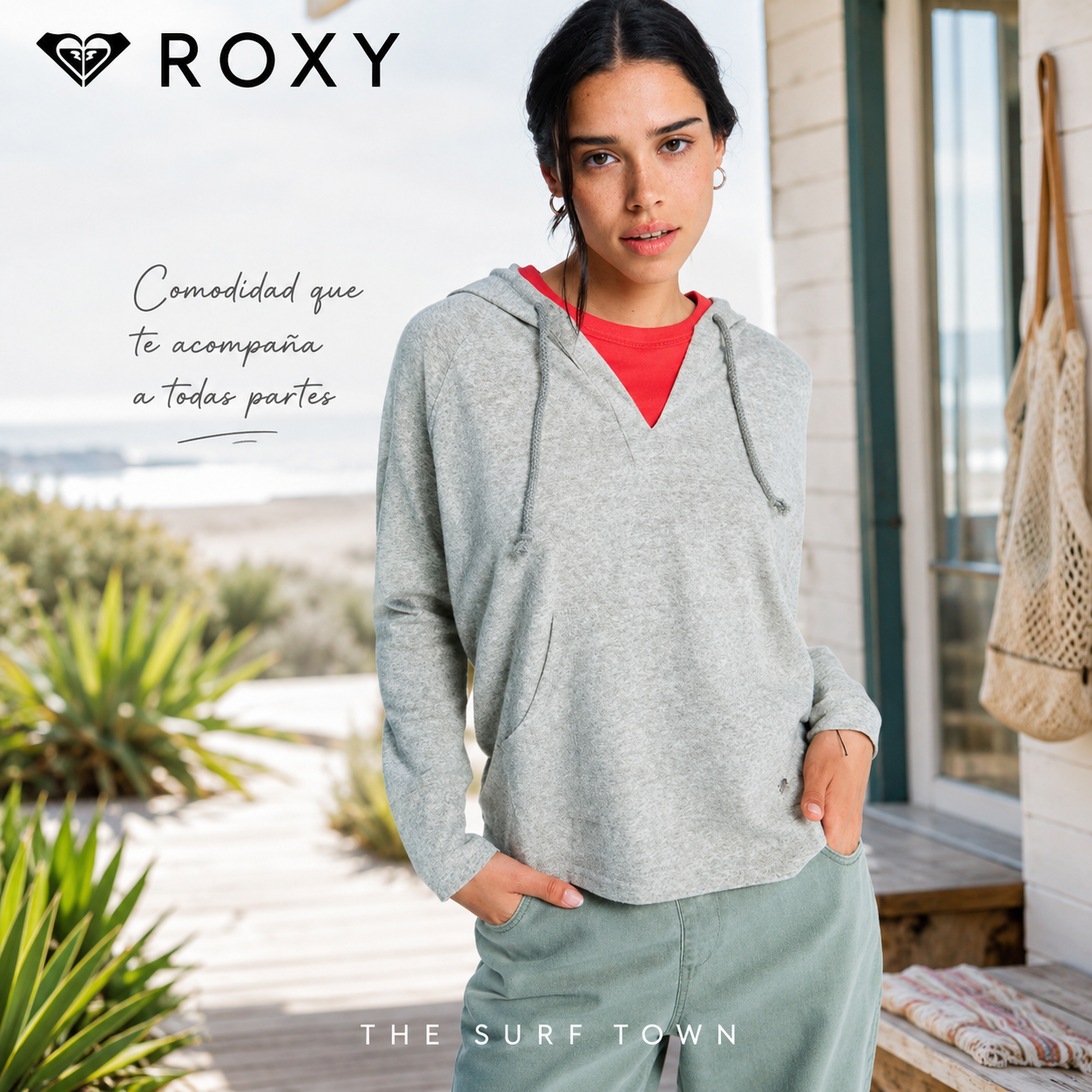 Fotografía editorial propia de THE SURF TOWN de la sudadera Roxy Destination Surf Oil Green para mujer en ambiente coastal lifestyle junto al mar con estilo surf casual femenino.