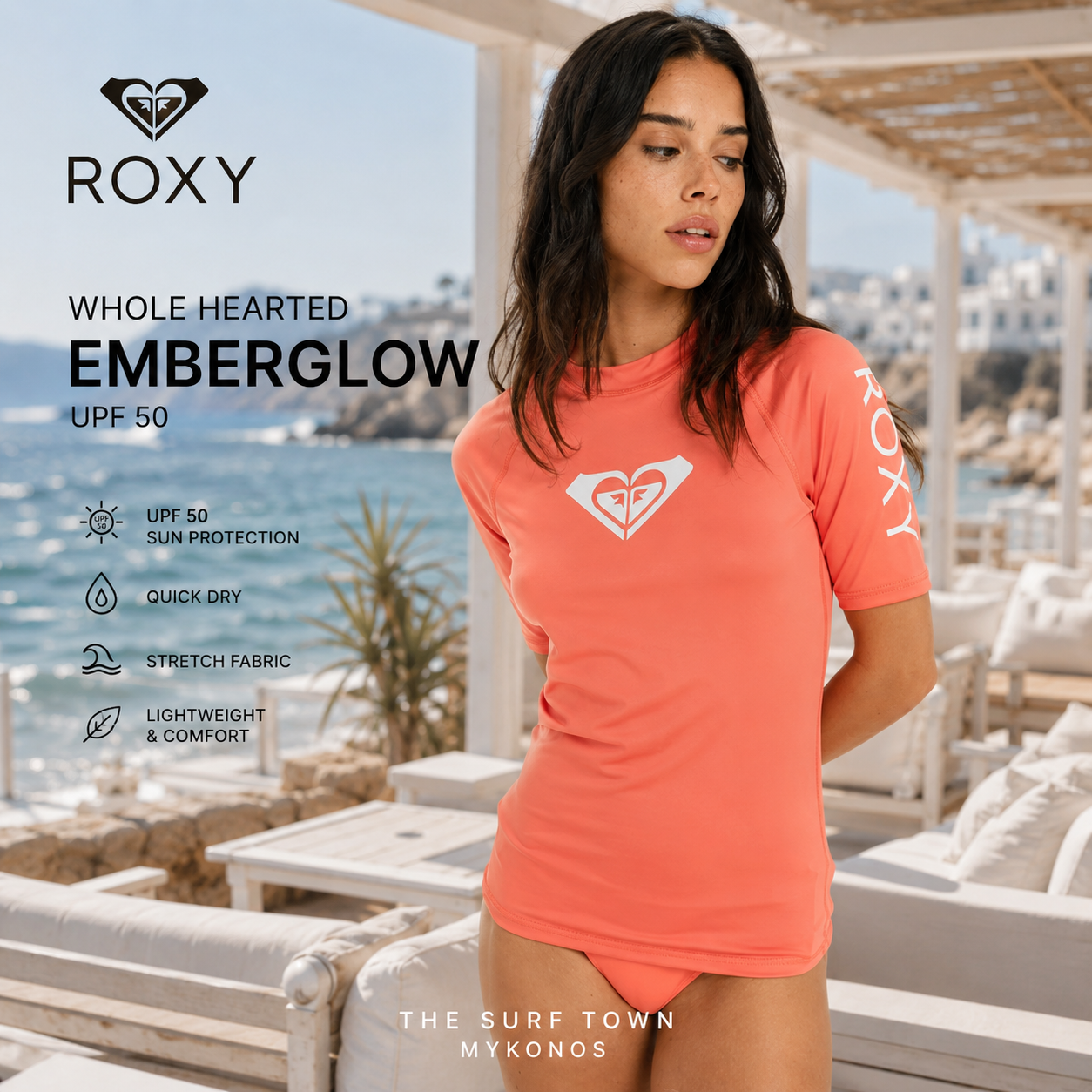 Fotografía propia de THE SURF TOWN de la licra Roxy Whole Hearted Emberglow UPF 50 para mujer en un beach club blanco de Mykonos con ambiente surf lifestyle premium y luz diurna mediterránea.