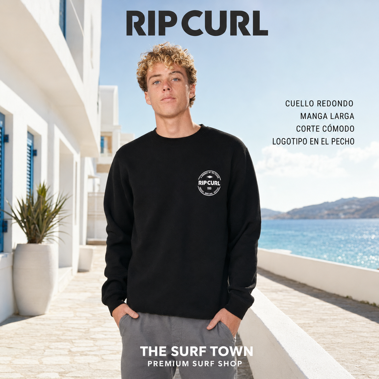 Sudadera Rip Curl Staple Crew Black para hombre con cuello redondo y pequeño gráfico blanco en el pecho, imagen editorial propia de THE SURF TOWN
