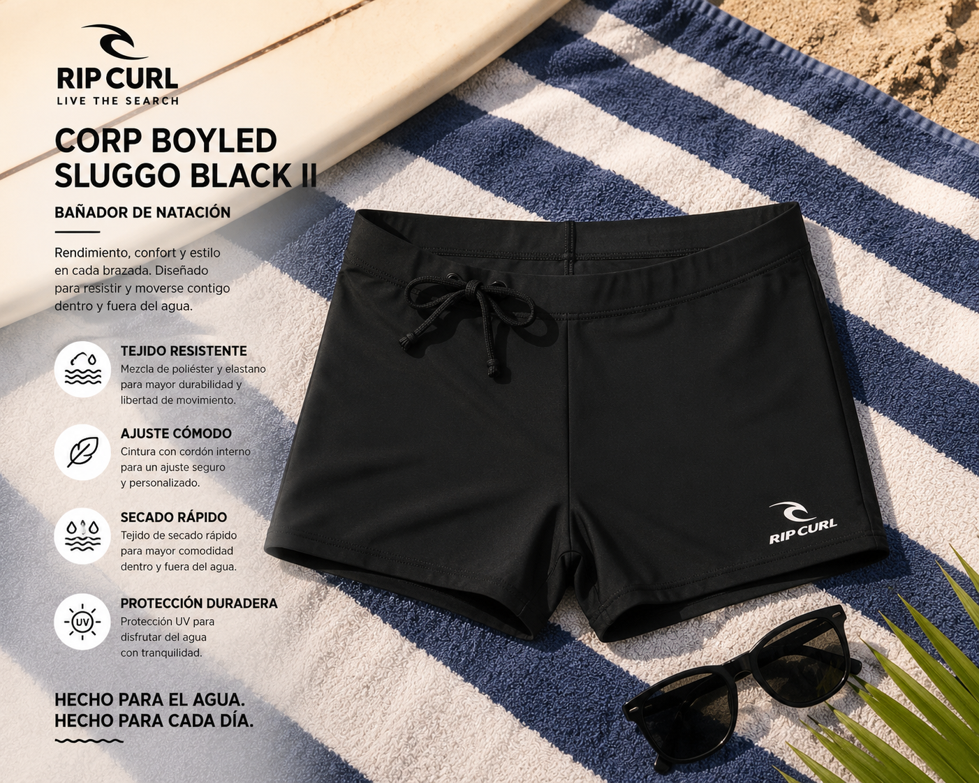 Bañador de natación Rip Curl Corp Boyleg Sluggo Black II sobre toalla de playa en escena surf lifestyle premium