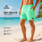 Fotografía propia de THE SURF TOWN del bañador Rip Curl Daily Volley 16 Neon Green para hombre en una playa caribeña de arena blanca, aguas turquesa y ambiente surf lifestyle premium.