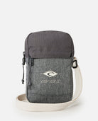 Bandolera RIP CURL Slim Pouch Search Grey Heather compacta gris con correa ajustable