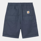 Bermudas Carhartt WIP Flint Short Dusky Blue Garment Dyed azul con cintura elástica y parche Carhartt WIP en la parte trasera