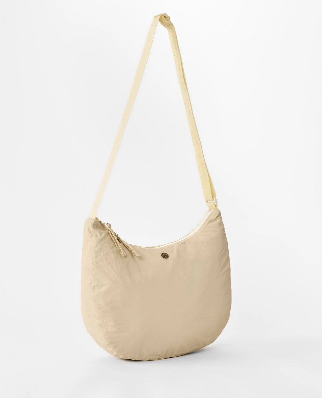 Bolso Rip Curl Everyday 8L Natural tipo bandolera en color beige para uso diario, viajes, playa y estilo surf lifestyle