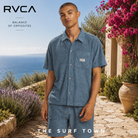 Camisa RVCA Exotica Vintage Navy para hombre en jardín mediterráneo premium frente al mar, fotografía editorial propia de THE SURF TOWN inspirada en el surf lifestyle sofisticado