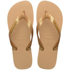 Chanclas Havaianas Top Logo Metallic Gold mujer con tiras doradas metálicas y suela cómoda de goma ideales para verano, playa y piscina
