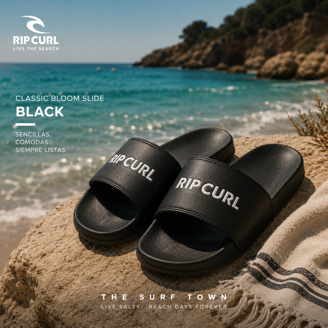 Chanclas de pala Rip Curl Classic Bloom Slide Black en fotografía editorial propia de THE SURF TOWN sobre una playa mediterránea de arena blanca