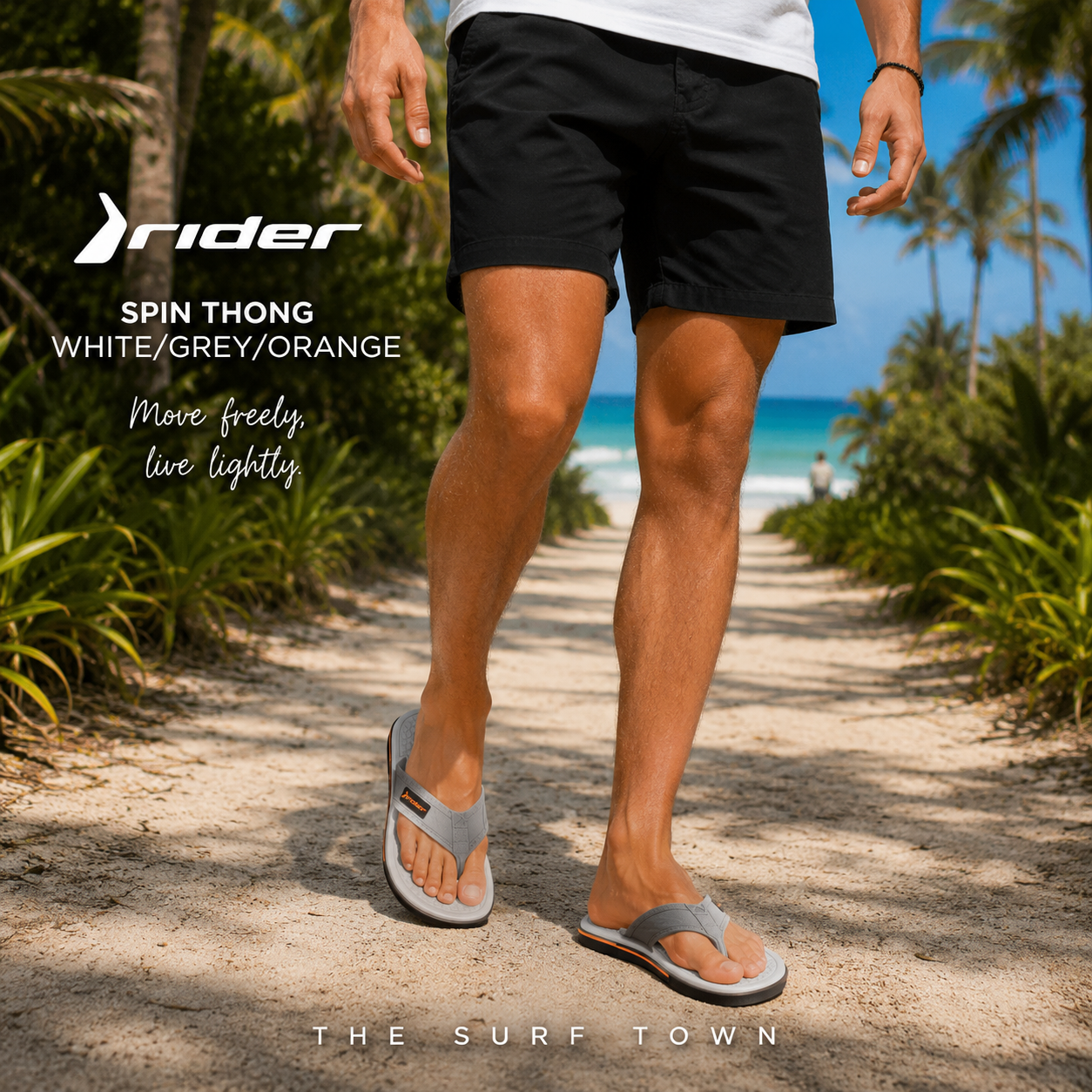 Chanclas Rider Spin Thong White Grey Orange en fotografía editorial propia de THE SURF TOWN en camino de arena blanca entre palmeras con estilo beach lifestyle masculino