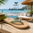 Chanclas Roxy Porto Sage en fotografía editorial propia de THE SURF TOWN sobre mesa de piedra en beach club tropical premium frente al mar, sandalias de verano cómodas para playa, vacaciones y lifestyle costero.
