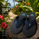 Fotografía propia de THE SURF TOWN de las chanclas Vissla Deep Water Open Toe Navy para hombre en un jardín tropical de Hawái con flores exóticas, vegetación exuberante y ambiente surf lifestyle premium.