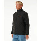 Chaqueta RIP CURL Classic Surf Black hombre acolchada negra con cremallera estilo surf urbano