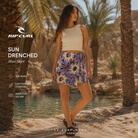 Fotografía propia de THE SURF TOWN de la mini falda Rip Curl Sun Drenched para mujer en un oasis del desierto con agua cristalina, palmeras naturales y ambiente surf lifestyle premium.