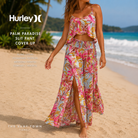 Falda Hurley Palm Paradise Slit Pant Cover Up en fotografía editorial propia de THE SURF TOWN con estampado tropical, abertura frontal y estilo resort premium junto al mar