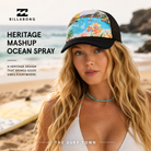 imagen editorial propia de the surf town de mujer en la playa con gorra billanong mashup ocean spray