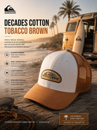 Gorra Quiksilver Decades Cotton Tobacco Brown trucker marrón y blanca en escena editorial surf heritage coastal premium