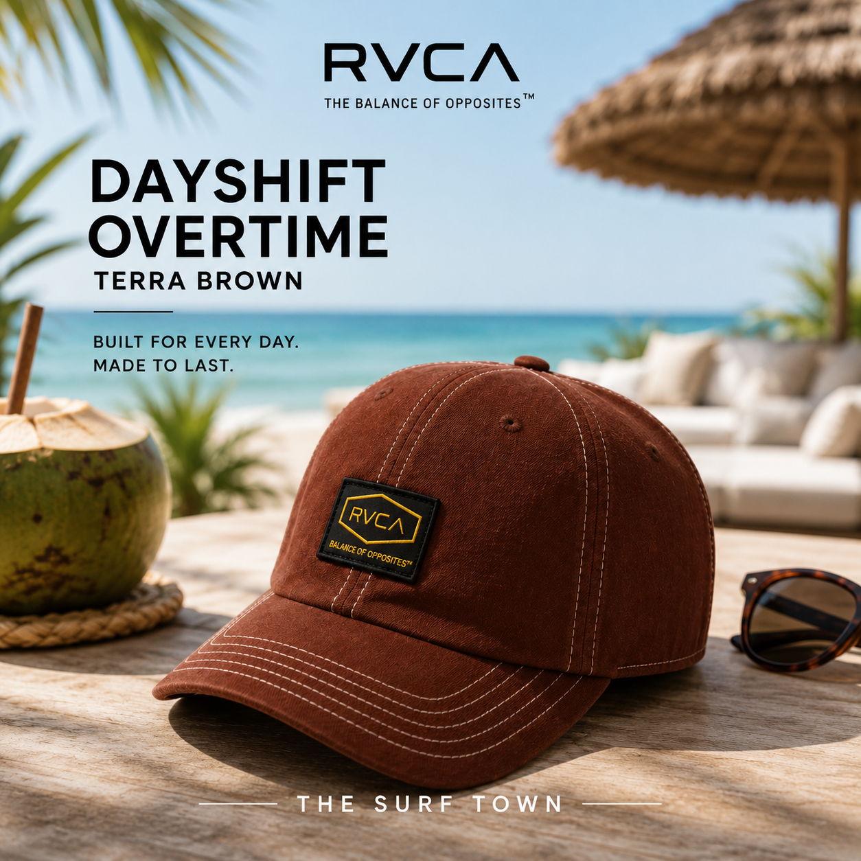 Gorra RVCA Dayshift Overtime Terra Brown en fotografía editorial propia de THE SURF TOWN en beach club tropical premium frente al mar, gorra marrón estilo surf lifestyle para vacaciones y verano.