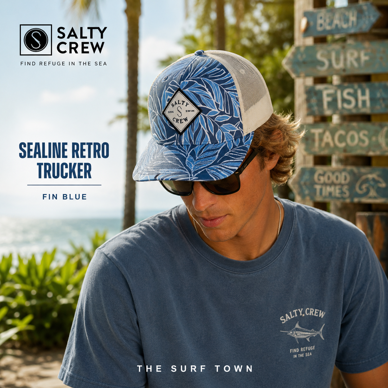 Gorra Salty Crew Sealine Retro Trucker Fin Blue con estampado tropical azul y panel trasero de rejilla