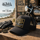 Gorra Von Dutch CAS 1 Black en fotografía editorial propia de THE SURF TOWN en ambiente cafe racer junto a moto clásica, estilo vintage California road trip y cultura motera americana.