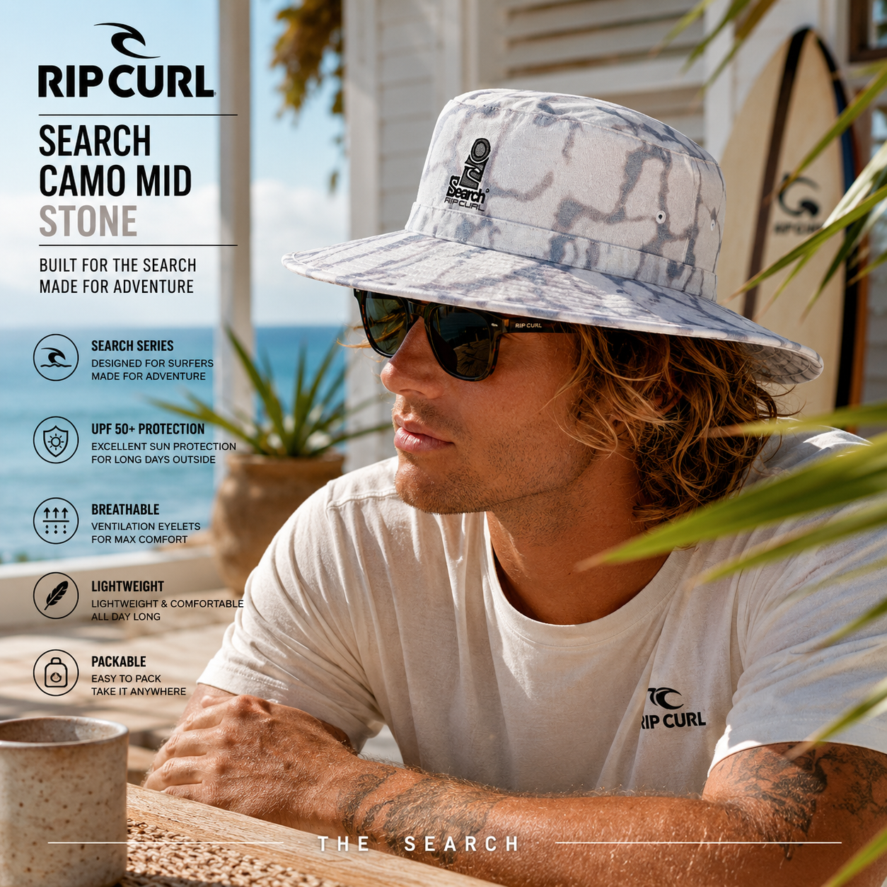 Gorro Rip Curl Search Camo Mid Stone en fotografía editorial propia de THE SURF TOWN en beach house australiana frente al mar con diseño camo, protección solar, estilo surf adventure y uso outdoor para playa, viajes y exploración.