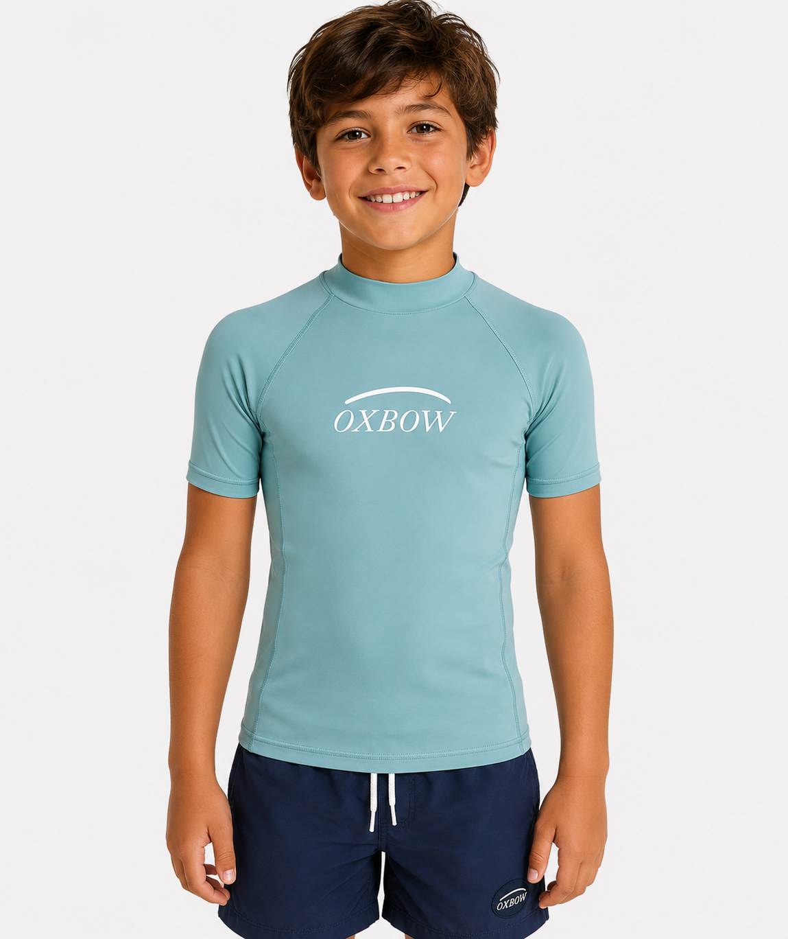 Licra Oxbow verde agua de niño para surf y playa con protección solar UV y estilo surfwear infantil verano 2026