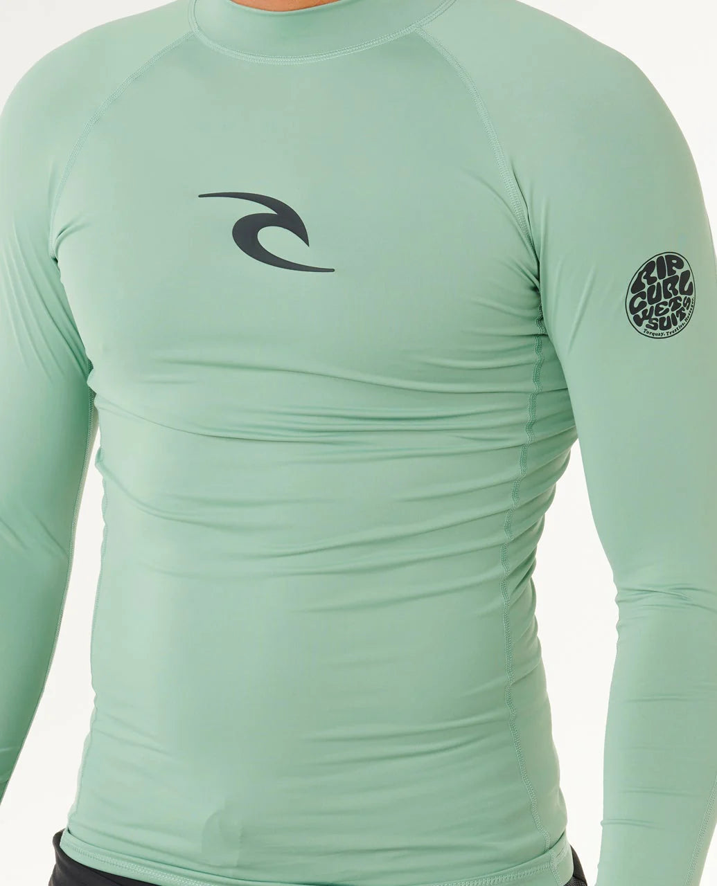 Licra Rip Curl Waves UPF50 Performance Aloe LS para hombre en color verde aloe con protección solar UPF50+ para surf y actividades acuáticas