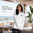 Licra Salty Crew Thrill Seekers Crew Sunshirt White en beach club premium junto al mar, fotografía editorial propia de THE SURF TOWN con protección solar UPF y estilo surf lifestyle femenino