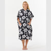 Poncho toalla RIP CURL negro con flores blancas con capucha y bolsillo para surf playa