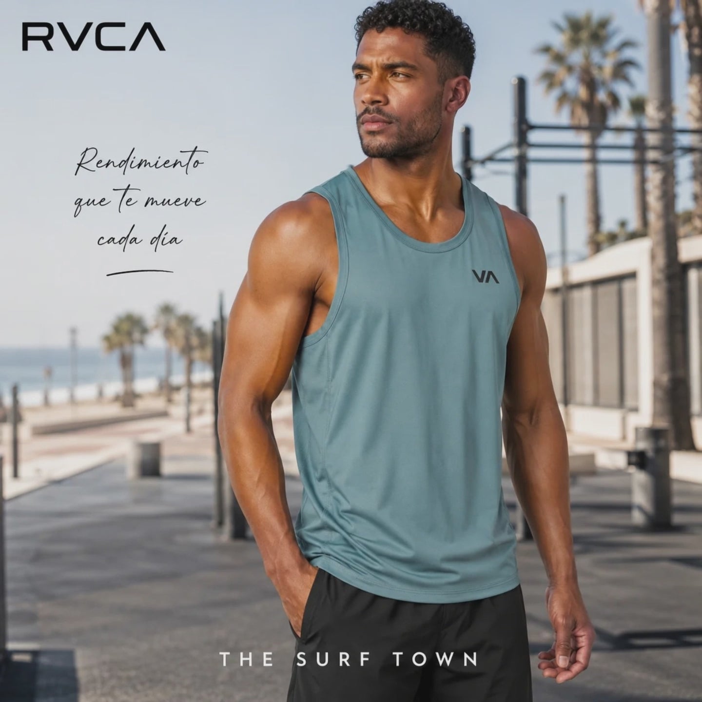 modelo vistiendo una Camiseta Rvca Sport Vent Lead en un video promocional de the surf town grabado en un paseo maritimo mediterraneo