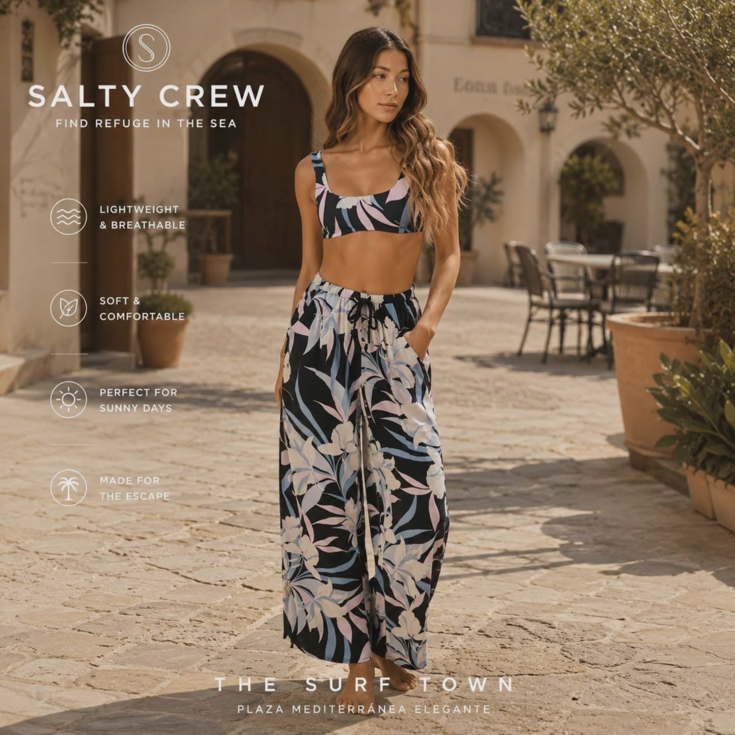 video promocional propio de the surf town de modelo llevando unos pantalones de verano salty crew dreamland con estampado floral en patio exterior de resort premium