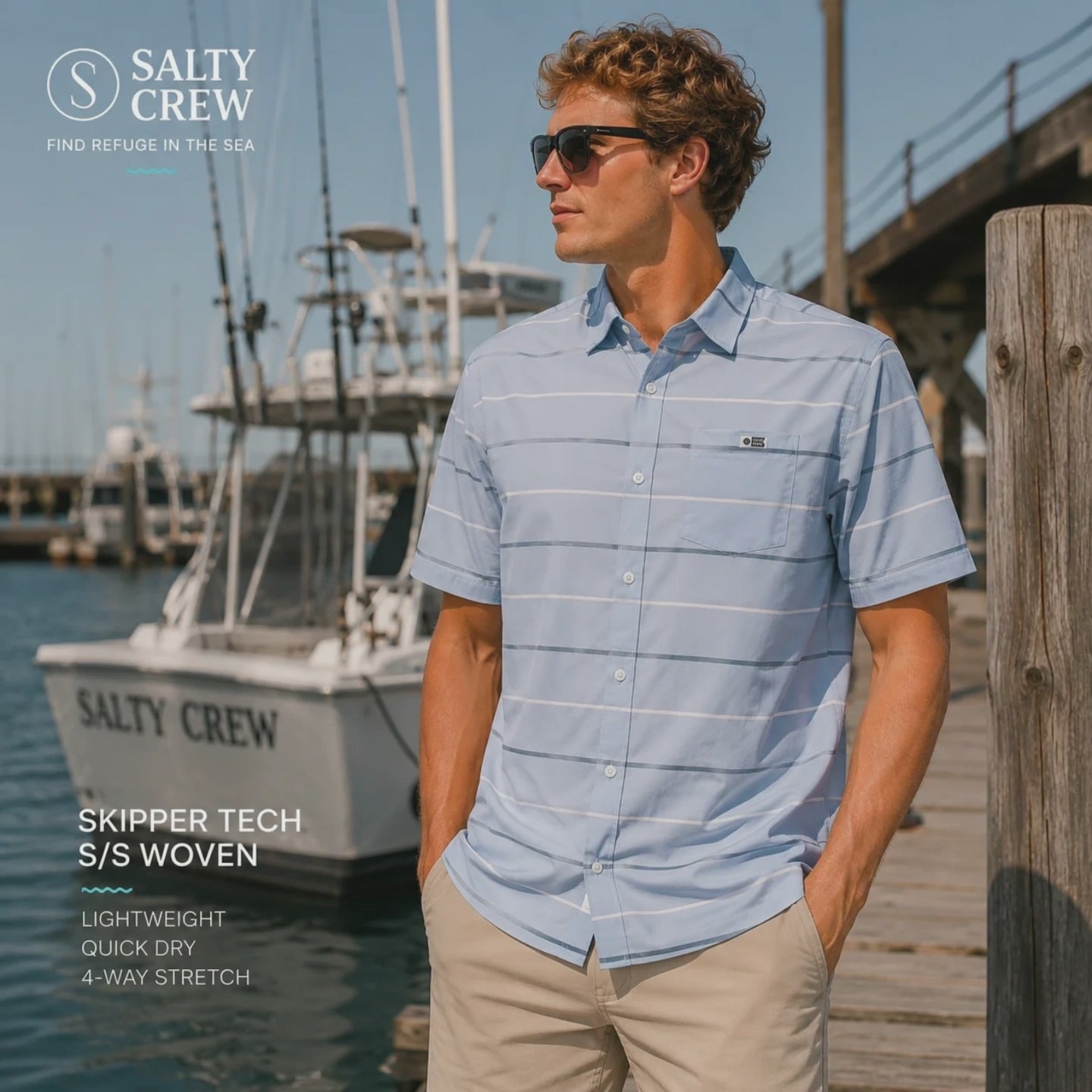 Modelo llevando una Camisa Salty Crew Skipper Tech Blue Fog durante una sesion de video promocional de the surf town en un puerto deportivo