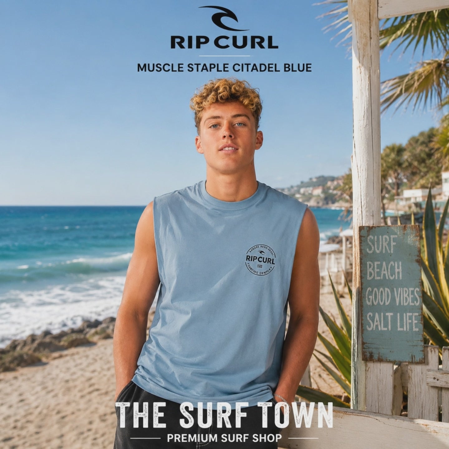 modelo llevando una Camiseta Rip Curl Muscle Staple Citadel Blue durante un video propio promocional de the surf town en la playa