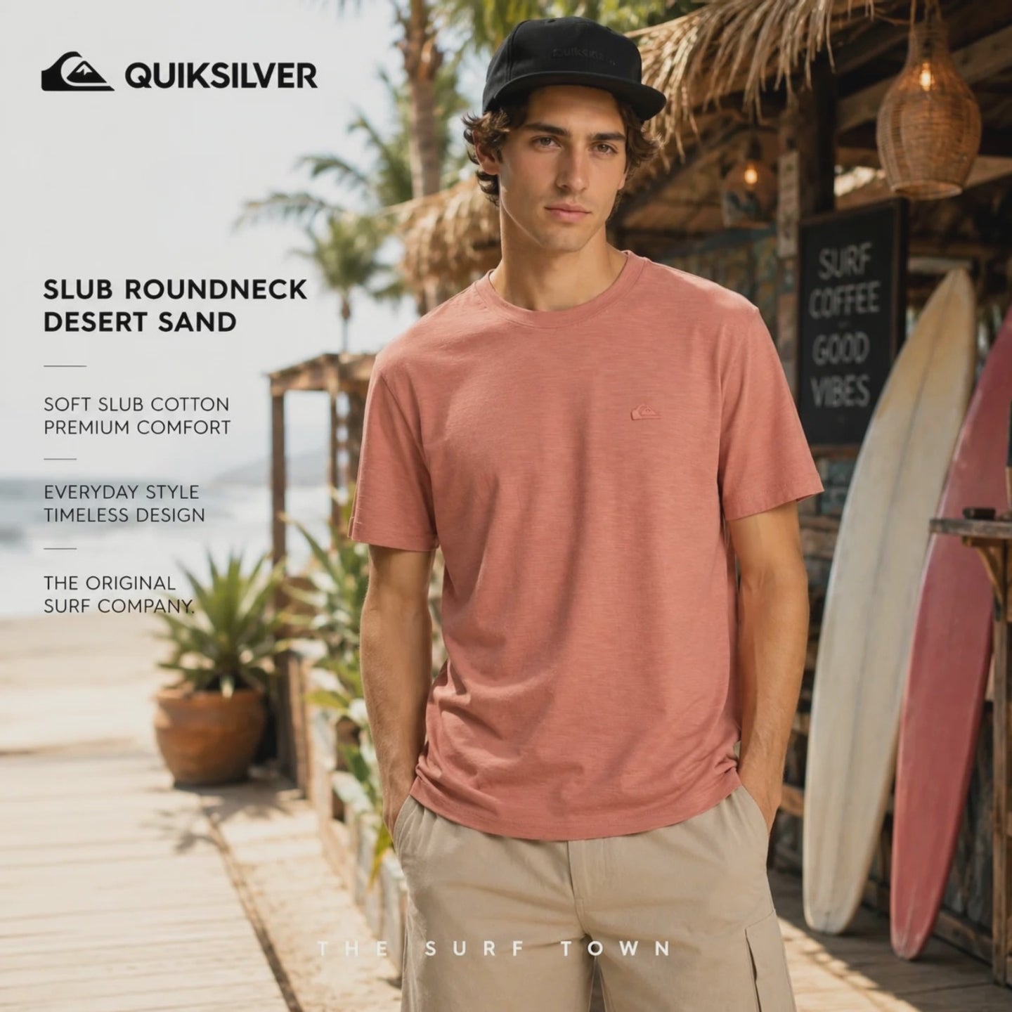 modelo vistiendo una Camiseta Quiksilver Slub Roundneck Desert Sand en un video promocional propio de the surf town en el exterior de una calle de Bali cerca del mar
