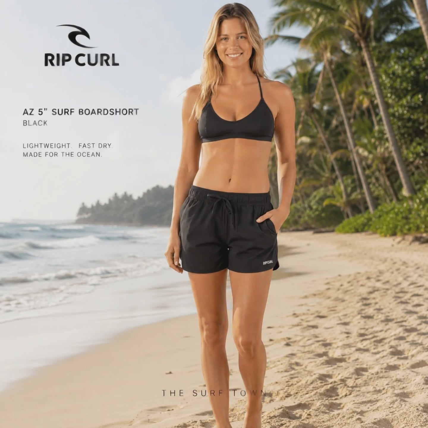 modelo vistiendo unos Pantalones Rip Curl Amazon 5in Surf Boarshort Black durante un video promocional propio de the surf town en una playa paradisiaca
