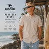 video editorial propio de the surf town de modelo llevando una camisa rip curl aerotech stone en un exterior con vistas al mar
