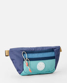 Riñonera Rip Curl Rip Waist Bag Multicolor en tonos azul y turquesa inspirados en el océano para viajes, playa y surf lifestyle