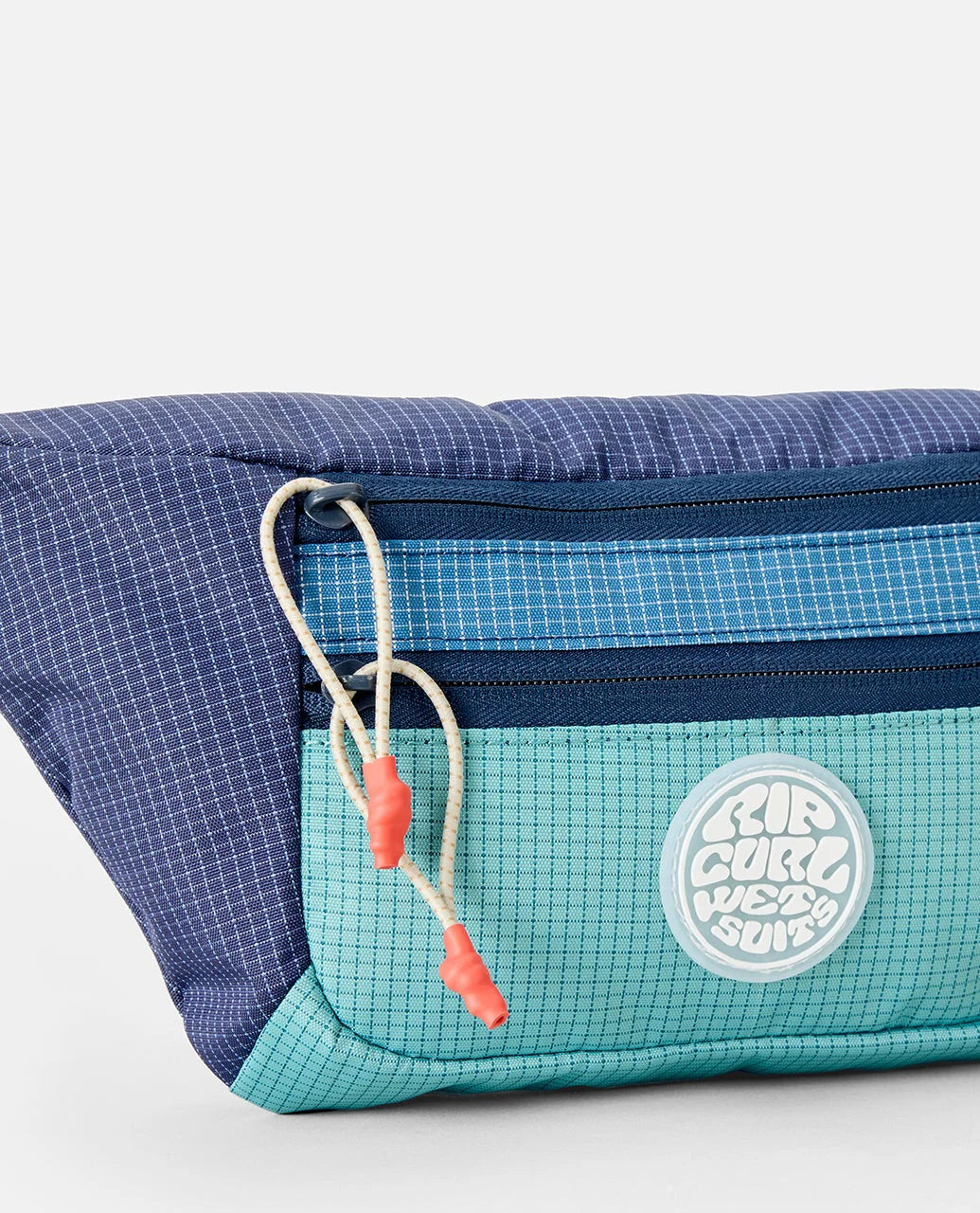 Riñonera Rip Curl Rip Waist Bag Multicolor en tonos azul y turquesa inspirados en el océano para viajes, playa y surf lifestyle